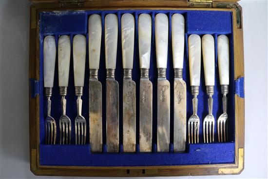 A cased set of twelve pairs of late Victorian mother of pearl handled silver dessert eaters, Sheffield, 1894.